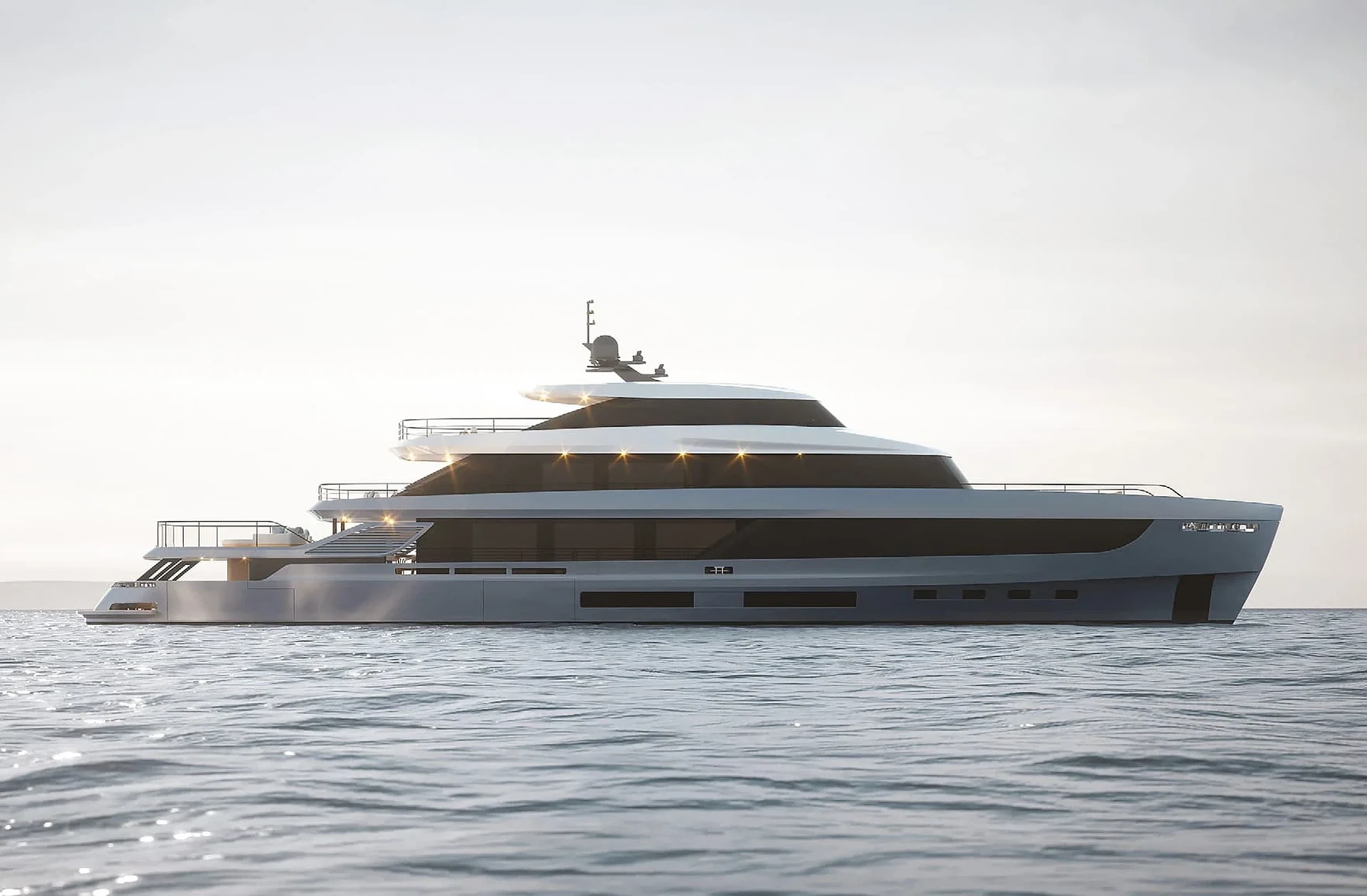 A superyacht at rest on a calm sea at dusk, deck lights on